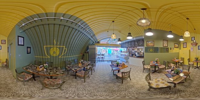 The cafe interior under its yellow arched ceiling.